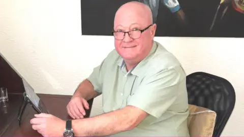 Brian McCormack in his home office