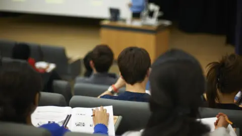 Cultura RM Exclusive/Peter Muller/Getty ImAGES Students sitting in university lecture hall