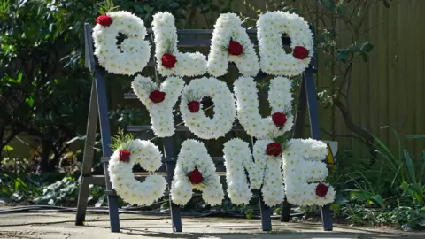 PA Media A floral tribute outside St Francis of Assisi church ahead of the funeral of The Wanted star Tom Parker in Queensway, Petts Wood