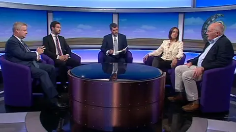 Four of the candidates seeking to be the new MP for Brecon and Radnorshire face questions from BBC Wales' Arwyn Jones in the centre. They are Chris Davies, Conservative Party; Tom Davies, Labour Party; Jane Dodds, Liberal Democrat Party; Des Parkinson, Brexit Party