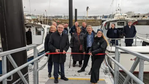 The ribbon being cut at the new Mayflower Pontoons facility in Plymouth