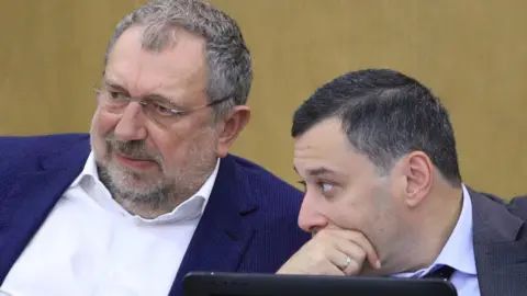 Getty Images Vladislav Reznik (L) in Duma, 27 Sep 18