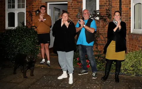 Getty Images Residents in Northampton cheer for the NHS