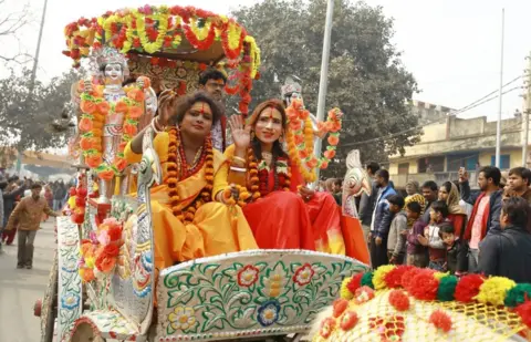 BBC Congregations often arrive at the Kumbh on chariots