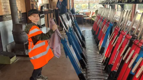 Severn Valley Railway Corey playing with levers in a signal box