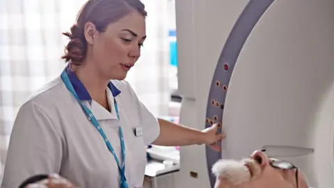 Cancer Research UK A man being treated by a nurse