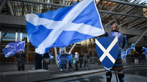 Getty Images Independence supporters outside the Scottish Parliament