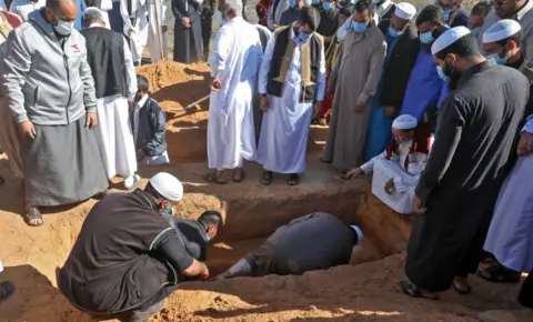AFP One of the exhumed bodies is buried on 13 November 2020