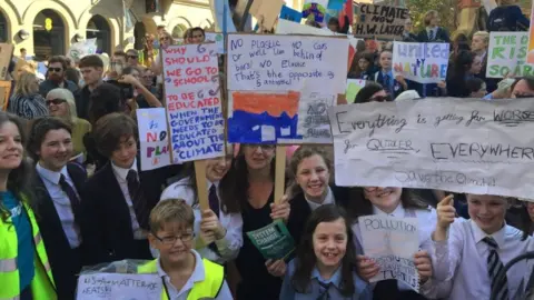 PA Media Children at the climate change demonstration in Belfast