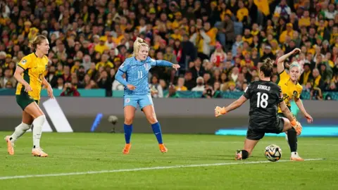 PA Media Lauren Hemp scores England's second goal against Australia