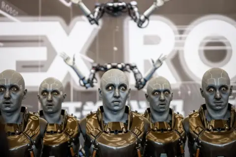 Mark R Cristino / EPA-EFE Robots mimic facial expressions during the World Robot Conference