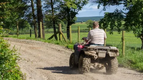 Getty Images Quad bike farmer