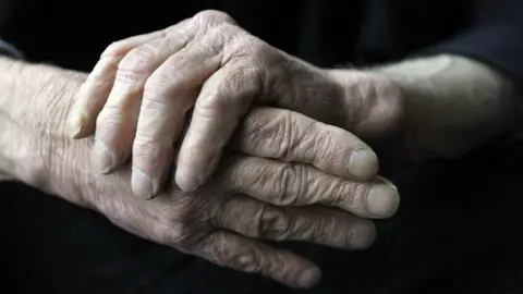 BBC An elderly man's hands