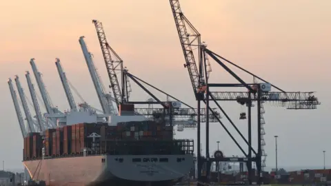 Getty Images A lot container ship docking at port