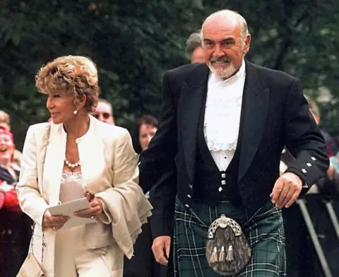 EPA Sean Connery with wife Micheline Roquebrune arriving at the opening of the first Scottish Parliament in Edinburgh in 1999