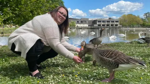 Slimbridge WWT Becca Gannaway-Pitts feeding ducks