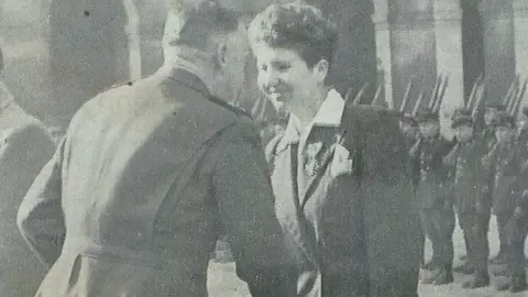 Richard Essberger Nicola Trahan being presented with an award