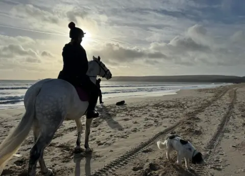 Tigger A fine morning for a ride - this scene was captured at Studland bay by Weather Watcher Tigger