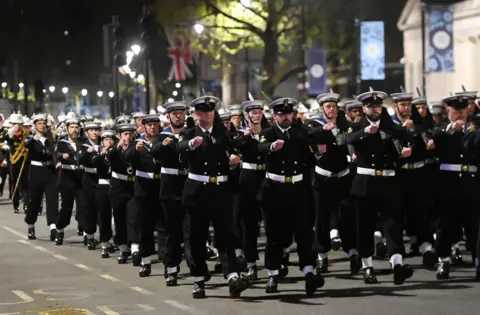 Andy Rain / EPA Royal Navy personnel march up Whitehall during the rehearsal for the Coronation in London.