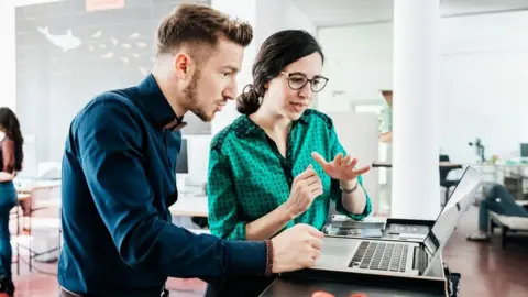 Getty Images Office workers