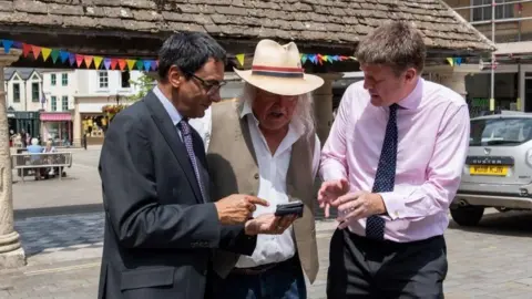 Wiltshire Council Terry Bracher, Phil Harding and Cllr Richard Clewer explore one of the app sights