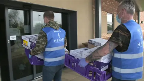 BBC Staff delivering food parcels