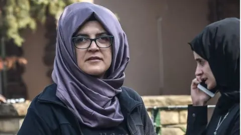 AFP Hatice Cengiz, fiancee of missing Saudi journalist Jamal Khashoggi, waits outside the Istanbul consulate, 3 October 2018