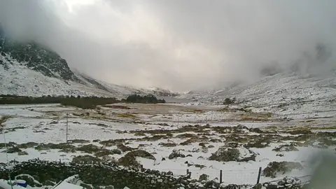 Ogwen Valley Mountain Rescue Snow looking across to Tryfan and Y Garn, from Ogwen Mountain Rescue base in Snowdonia, on 6 April, 2021