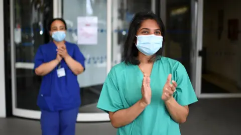 Getty Images Key workers at the Chelsea and Westminster Hospital join nationwide applause