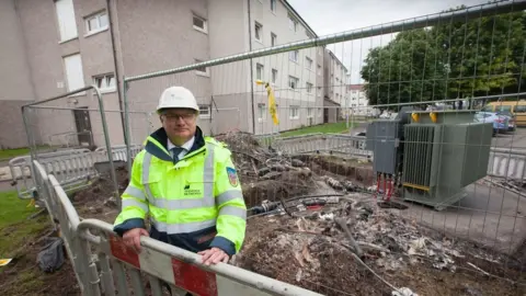 David Guthrie at the site of the fire