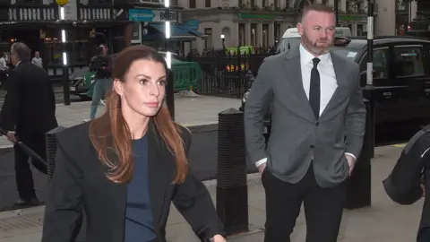 Getty Images Coleen and Wayne Rooney arriving at the High Court