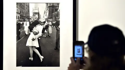 AFP A visitor takes a snapshot of VJ Day in Times Square, New York, 1945" by Alfred Eisenstaedt in Rome on April 30, 2013