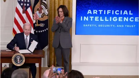 Getty Images Biden and Kamala Harris at the White House signing ceremony