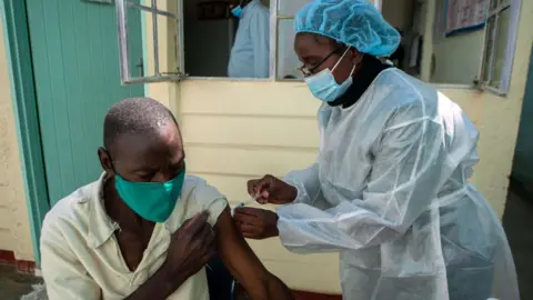 Getty Images Vaccine administered in Zimbabwe