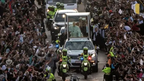 AFP Pope Francis waves from the Popemobile, upon arrival in Bogotá on 6 September 2017.