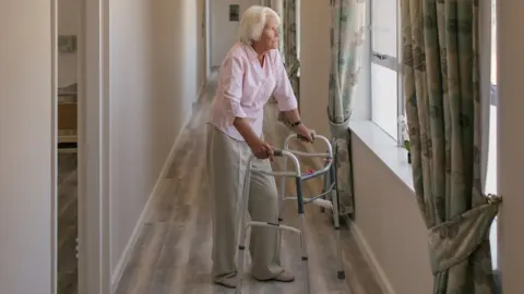 Getty Images Woman in a care home