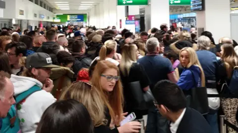 Jordan Ikin Large queue at airport