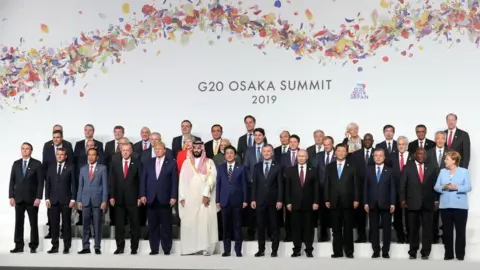 EPA World leaders pose during the Leaders family photograph at the G20 leaders summit in Osaka