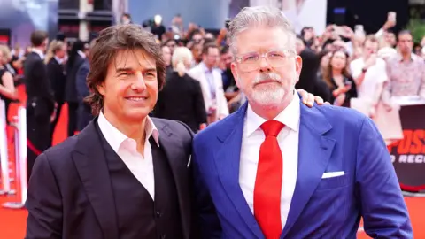 PA Media Tom Cruise (left) and Christopher McQuarrie arrive at the UK premiere of Mission: Impossible - Dead Reckoning Part One at Odeon Leicester Square in London. Picture date: Thursday June 22, 2023.