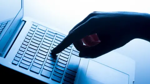 PA Media Person using a computer