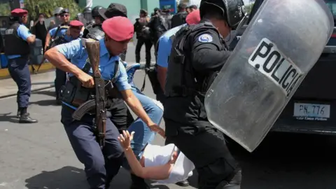 AFP Nicaraguan riot police detain a protester demanding the government release opposition activists, in Managua on March 16, 2019