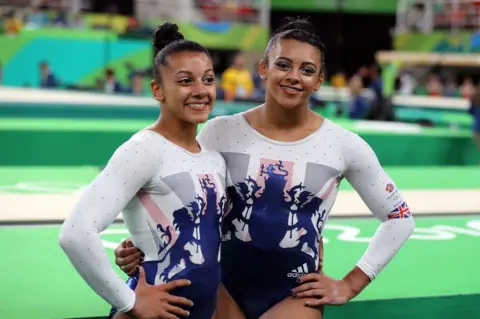 PA Media Ellie Downie (right) with sister Becky Downie