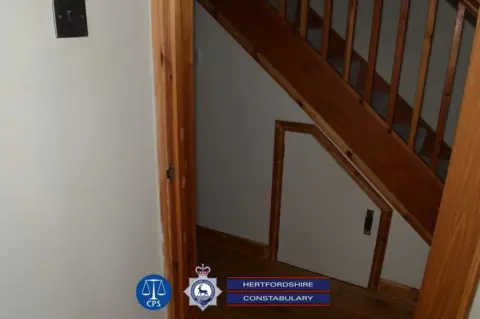 Hertfordshire Constabulary Image showing an under-stairs cupboard where Carrick falsely imprisoned two women, separately, on different occasions