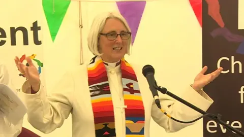 Bishop of St Davids Joanna Penberthy leads the prayers in the faith tent