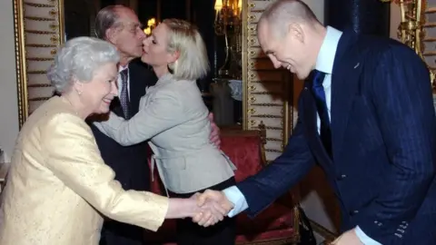 PA Media Mike Tindall shakes hands with the Queen in 2006