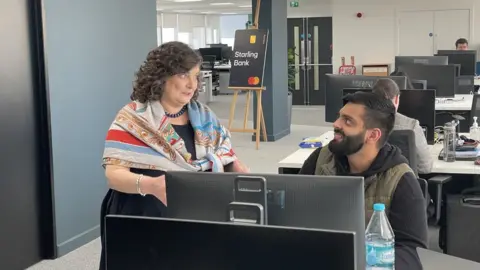 Anne Boden with a staff member at the Cardiff office