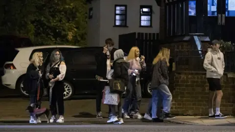 PA Media People leaving a Liverpool pub