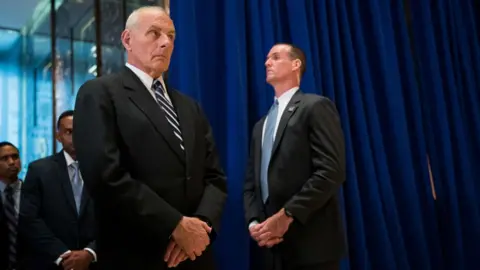 Getty Images Trump's chief of staff glanced down at his feet throughout the Tuesday press conference