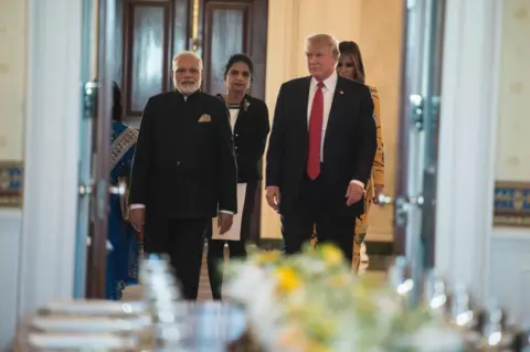 AFP/Getty Images Indian Prime Minister Narendra Modi (L), US President Donald Trump (2nd R) and First Lady Melania Trump arrive in the Blue Room for dinner at the White House in Washington, DC, on 26 June 2017.