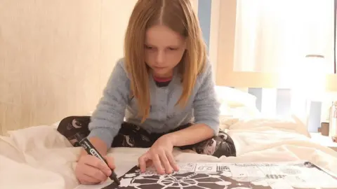 Polina draws a picture